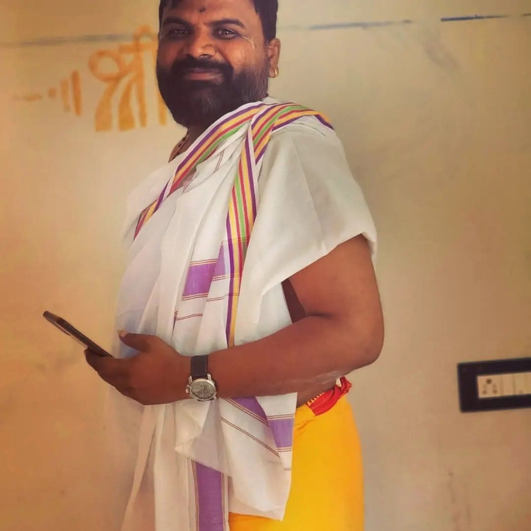 In traditional attire, ready for the day's rituals